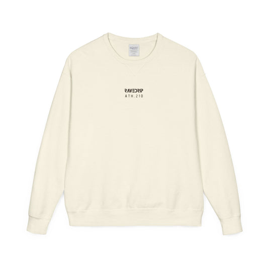 Front view flat lay of the RAVEDRIP Core crewneck sweatshirt in garment-dyed cream featuring a centered washed charcoal ATH.210 logo and V-notch collar detail on a pure white background.