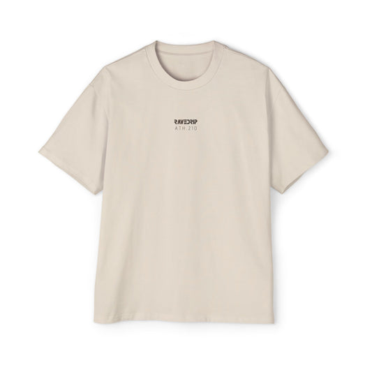 Front view of men's heavyweight oversized RAVEDRIP tee in Ecru featuring minimal charcoal grey logo and ATH.210 technical branding.