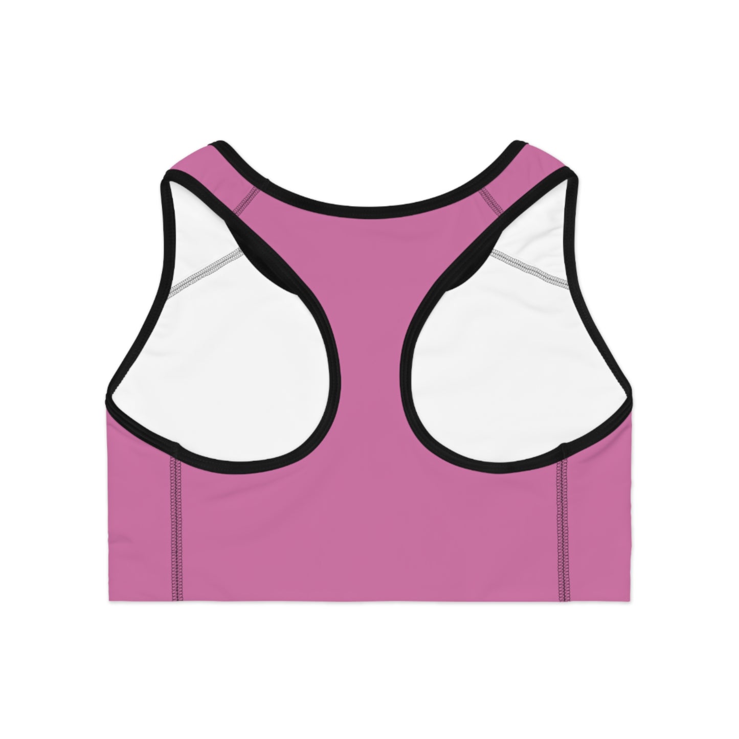 Back view of pink sports bra featuring racerback-style straps and a cheeky statement print in bold white font

