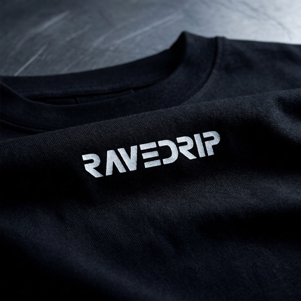Close-up of black Core Matrix Boxy Tee featuring the RAVEDRIP logo