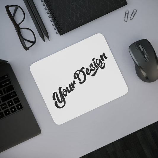 Customizable mouse pad with 'Your Design' text on a desk