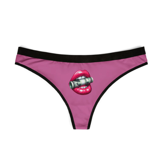 Front view of pink thong with bold money lips print, laid flat on white background

