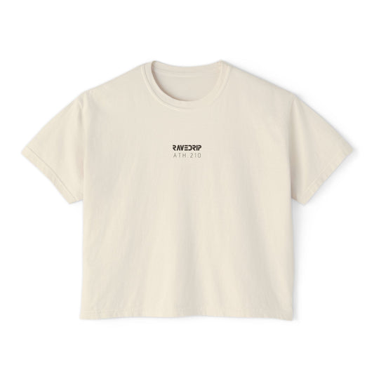 Front view of women's ivory boxy RAVEDRIP tee featuring minimal charcoal grey ATH.210 logo branding.