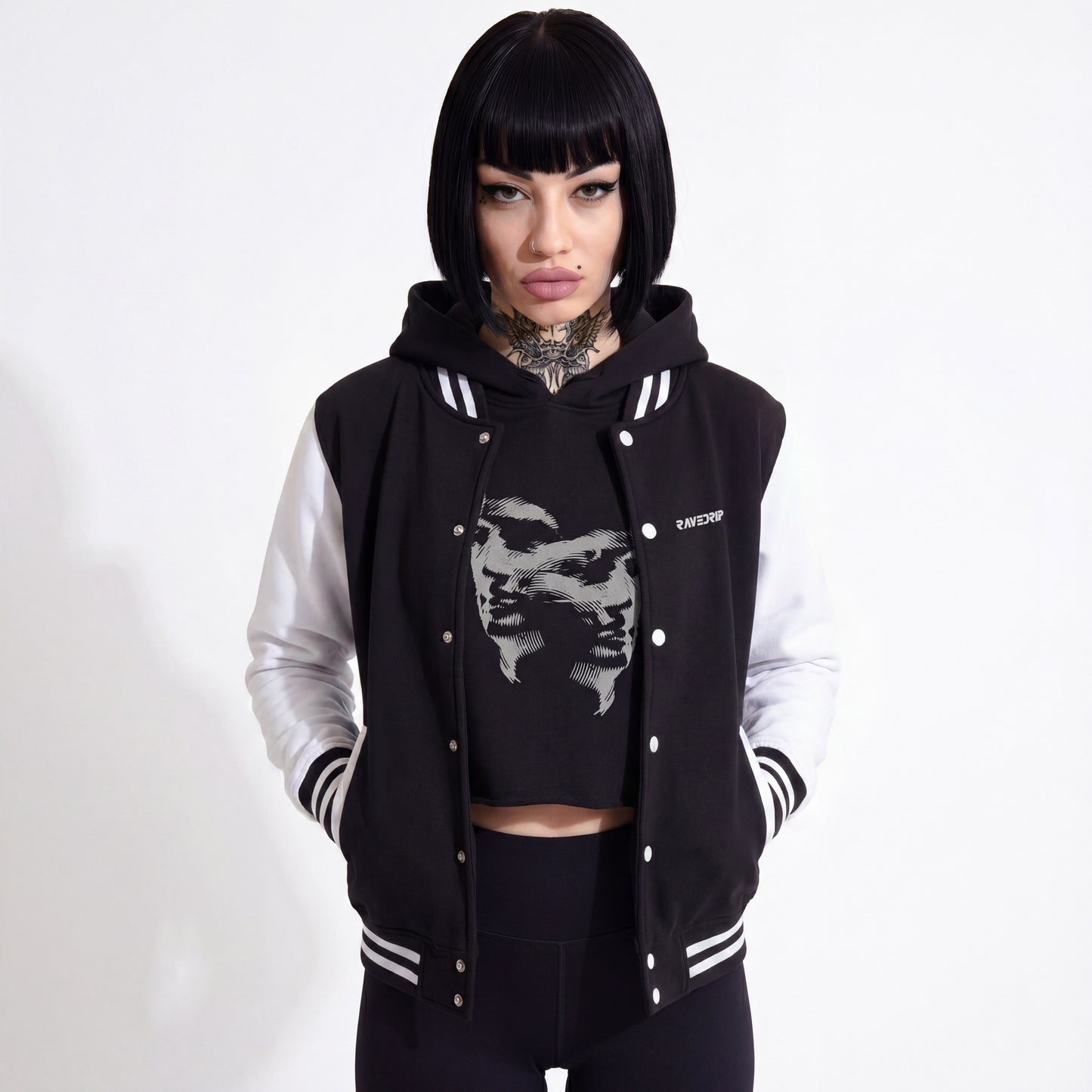 Model styling the RAVEDRIP monochrome heavyweight varsity jacket in a high-end streetwear look.
