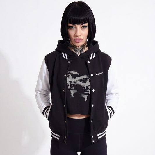 Model styling the RAVEDRIP monochrome heavyweight varsity jacket in a high-end streetwear look.