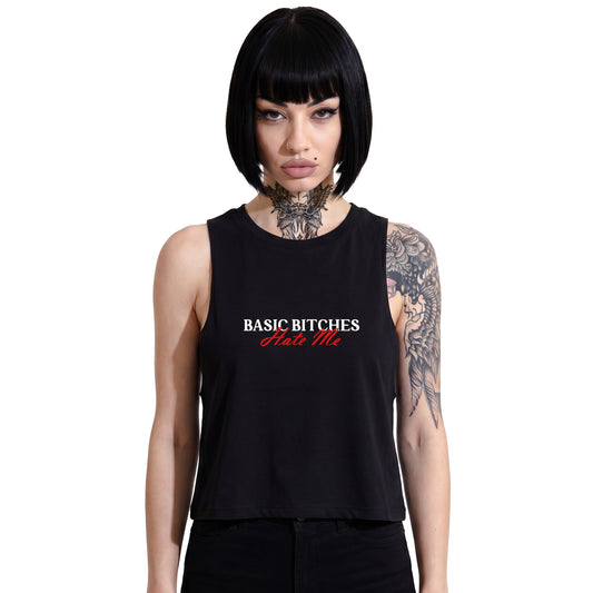 RAVEDRIP Basic Bitches Hate Me cropped muscle tank in black, premium sleeveless crop top with relaxed crew neck and custom white and red typography graphic print, worn by alternative female model
