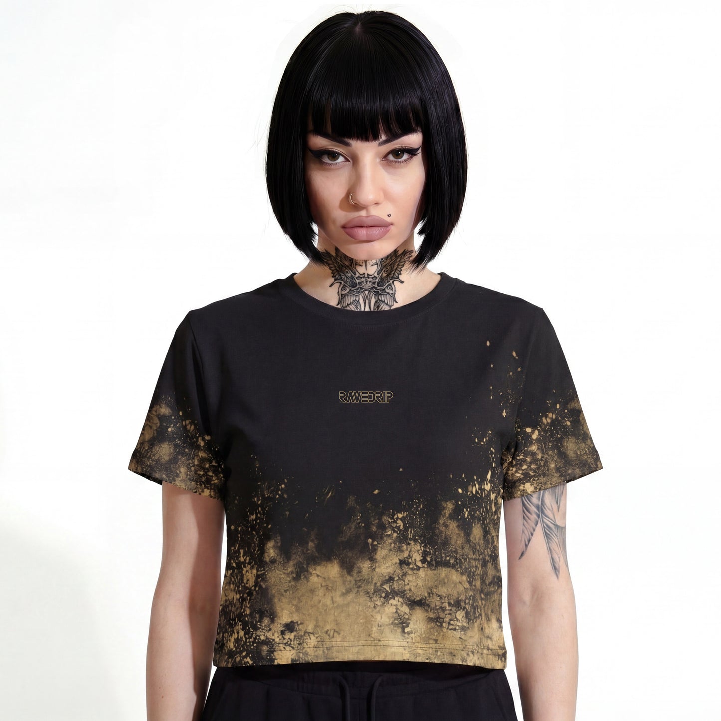 RAVEDRIP Distressed Gold AOP cropped tee, lightweight polyester women's relaxed fit crop t-shirt with short mid-bicep sleeves and metallic gold foil splatter grunge print, worn by alternative female model