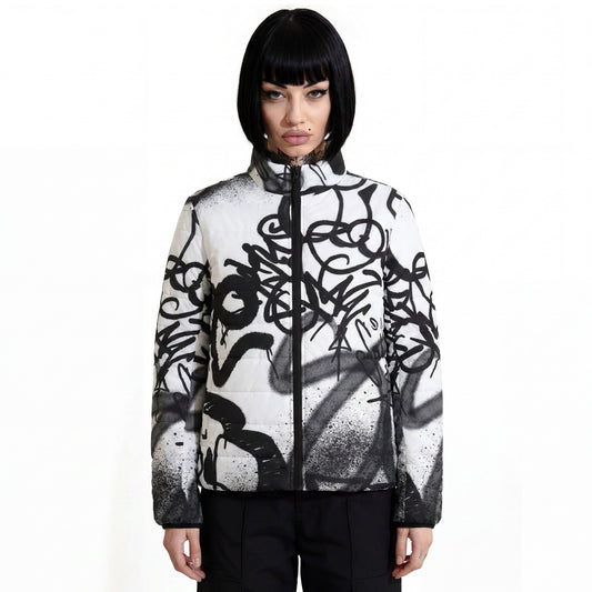 RAVEDRIP Womens Padded Puffer Jacket in white with high-contrast black graffiti spray paint all-over print and full-front nylon zipper, streetwear insulated outerwear worn by alternative female model.