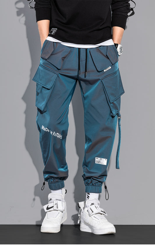 Techwear blue cargo pants for men with multiple pockets, modern fit, and breathable fabric. Front