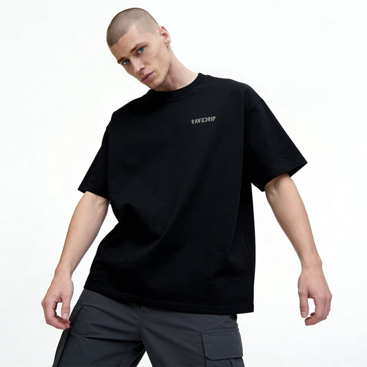 oversized streetwear t shirt with dual portrait back graphic on a male model front view 